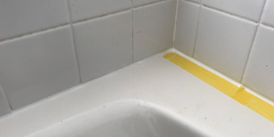 Painters tape gives a nice finish when caulking tubs.